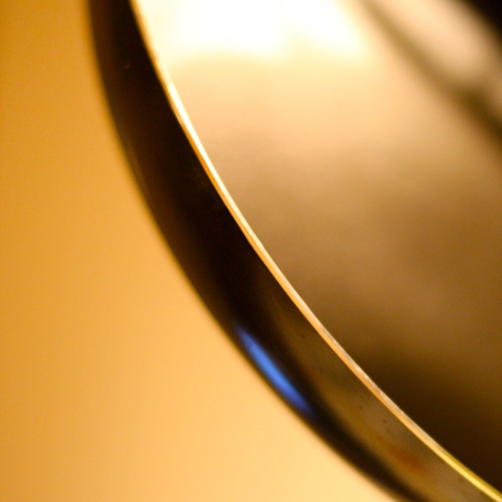 Dark frying pan on a plain background
